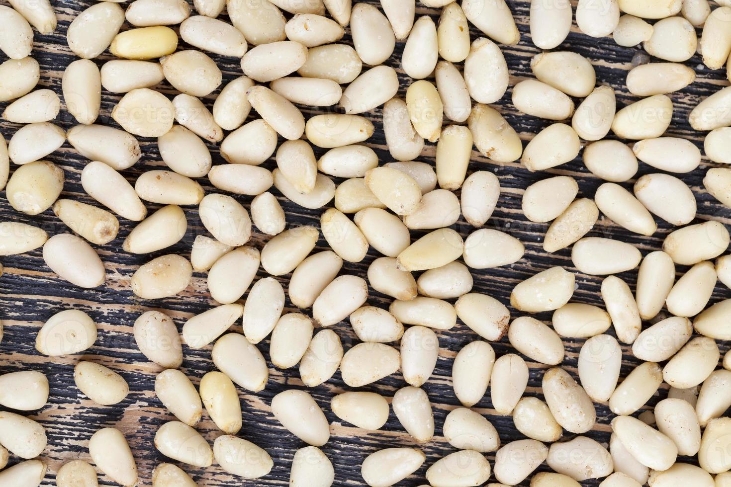 peeled pine nuts of small size photo