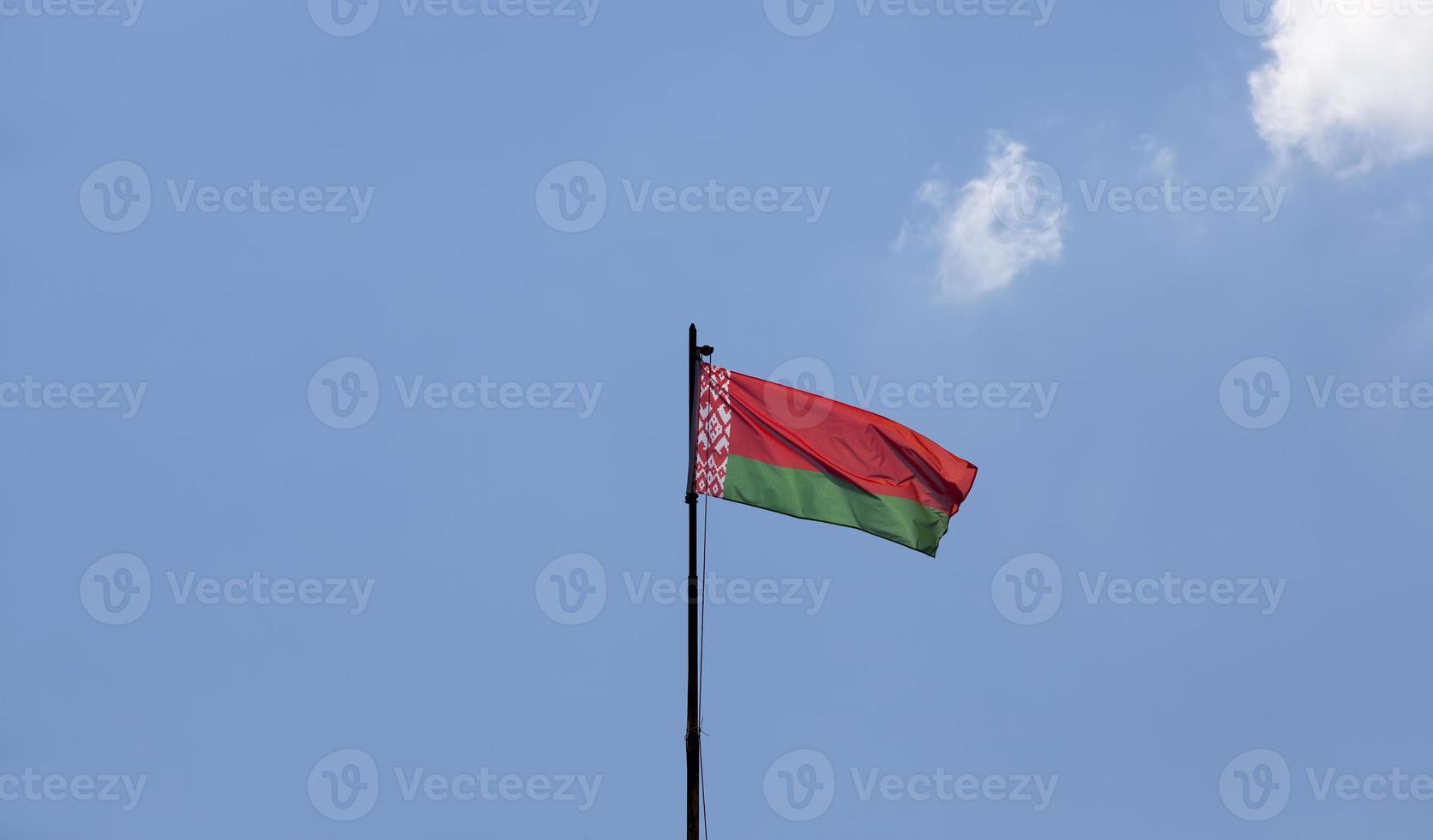 belarusian state flag on a blue sky photo