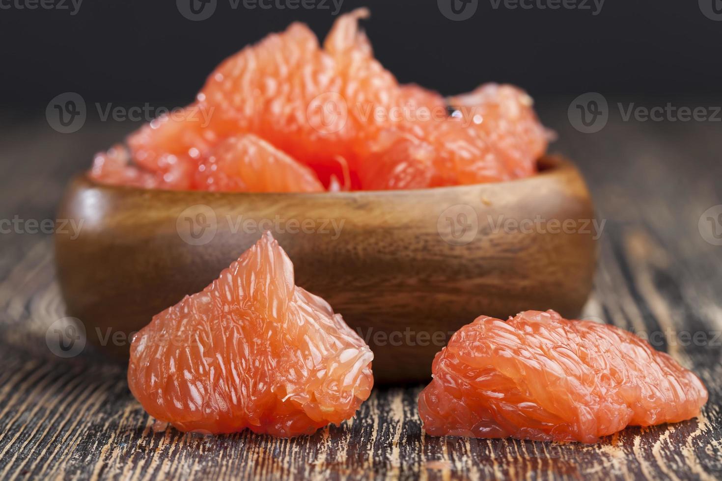 sour ripe grapefruit peeled and divided photo
