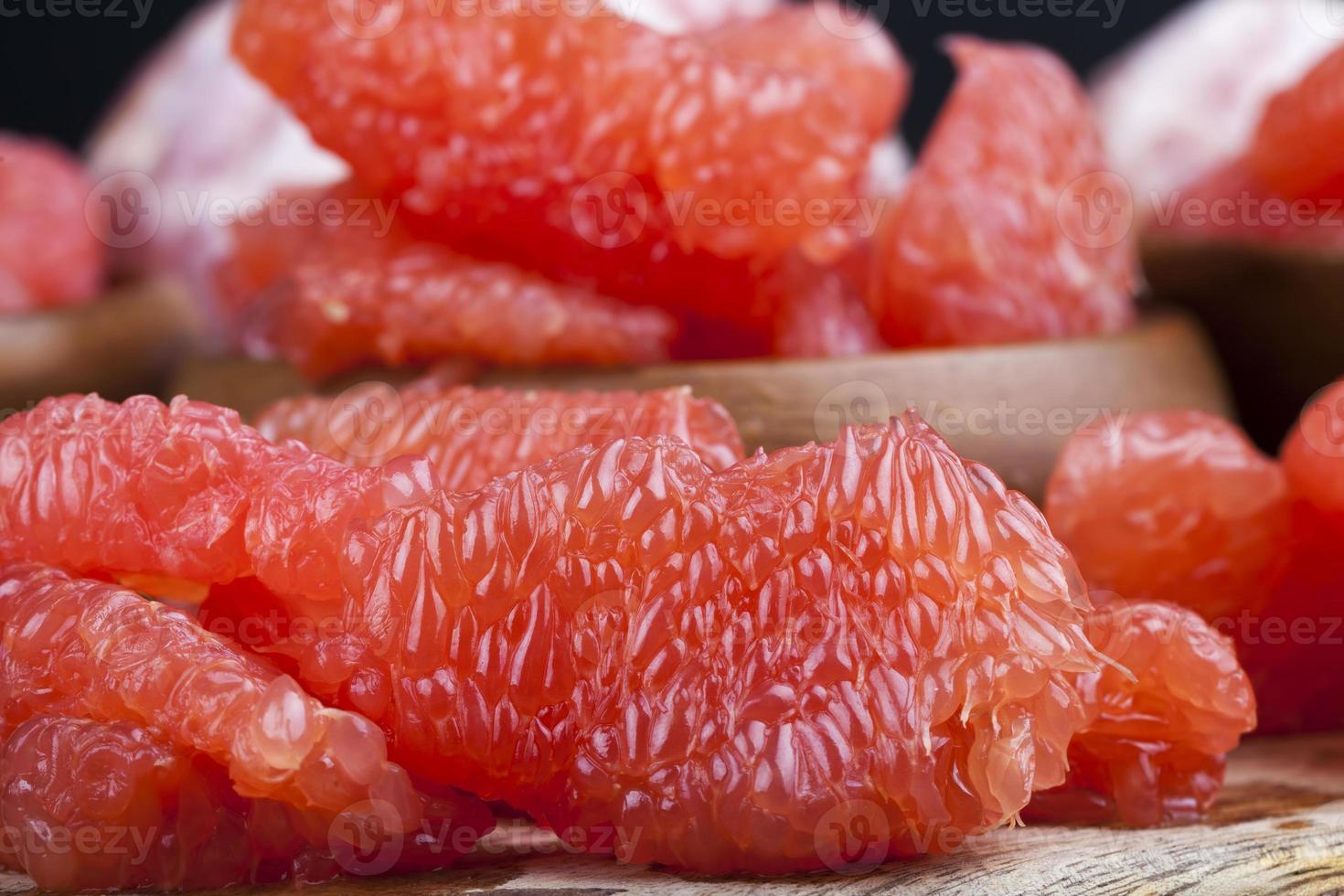 sour ripe grapefruit peeled and divided photo