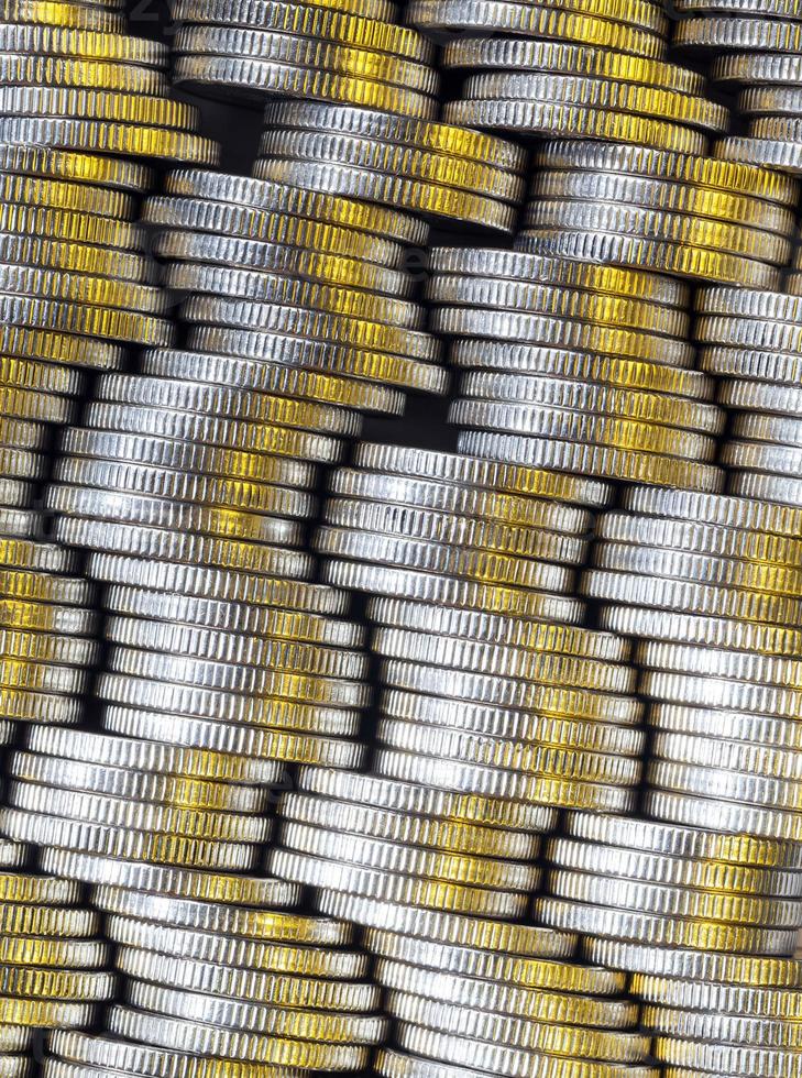 round shaped metal money stacked in a pile photo