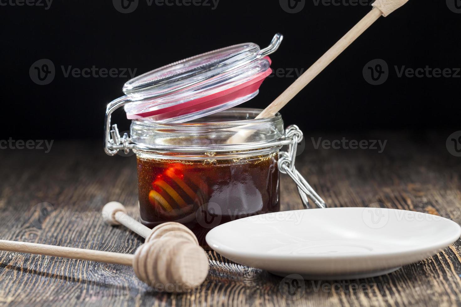 simple and self made ladle honey spoon is made of wood photo