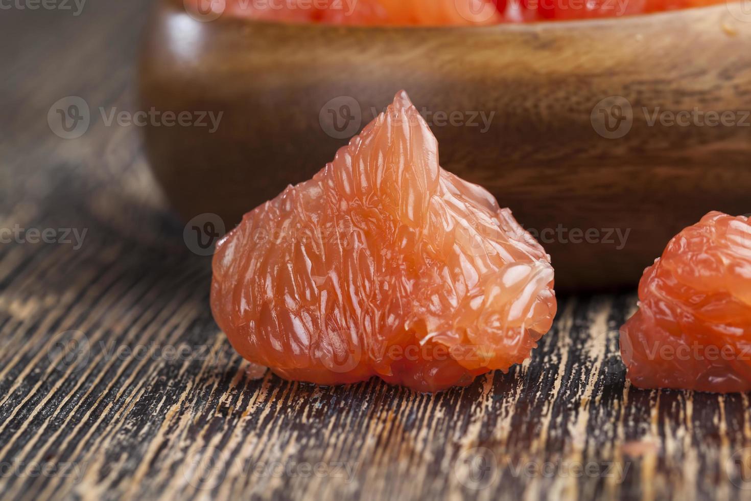 sour ripe grapefruit peeled and divided photo