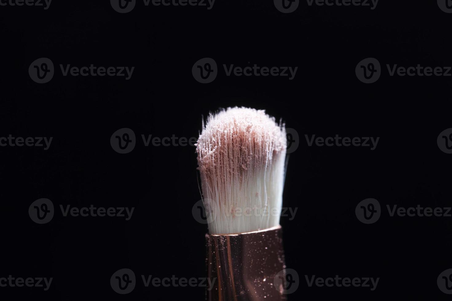 professional cosmetic brush with cosmetic product photo