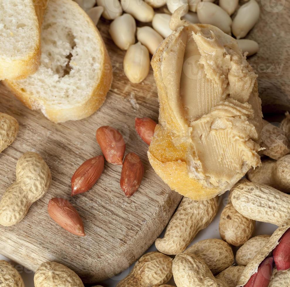 ingredients for preparing a quick Breakfast of bread and peanuts photo