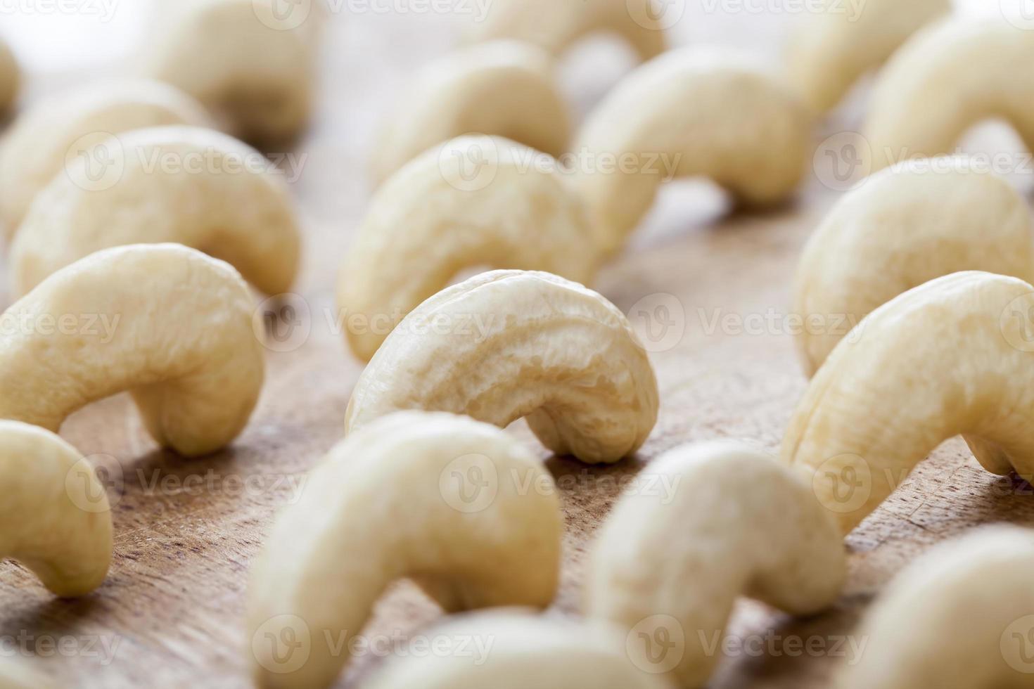 beautiful bent cashew nuts, fresh raw cashew photo
