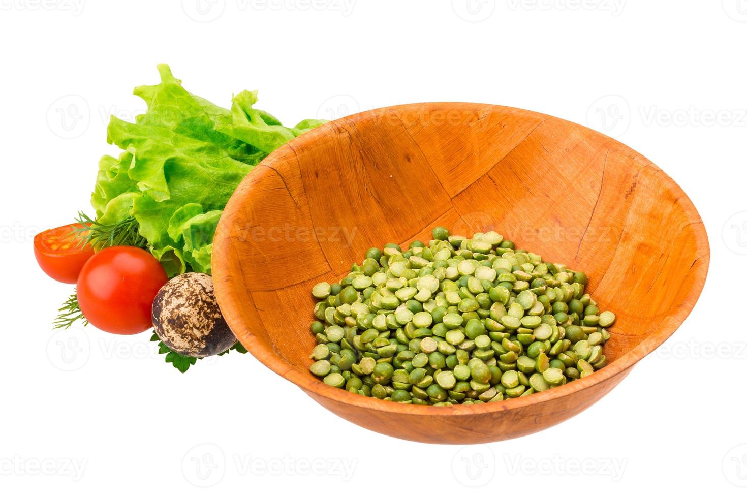 Dry green peas in a bowl on white background photo