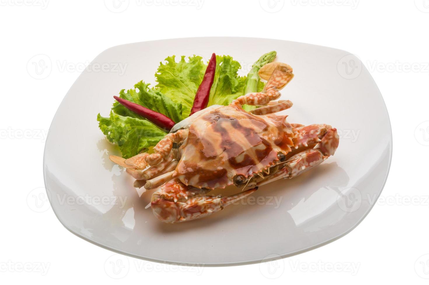 Red crab on the plate and white background photo