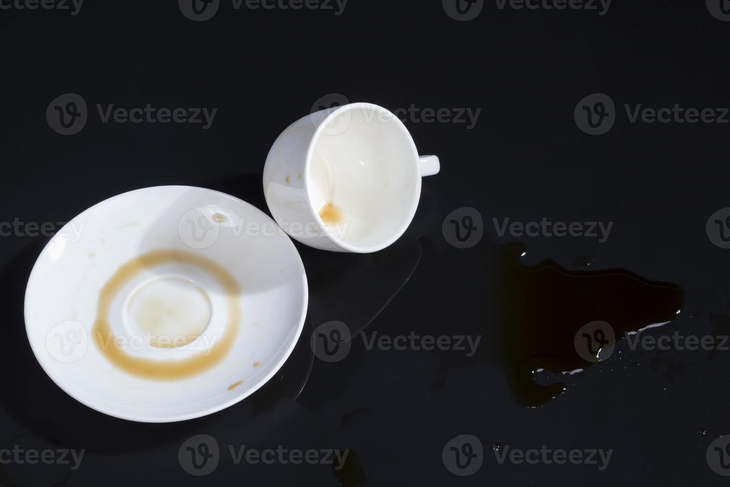 black aromatic coffee spilled due to carelessness photo