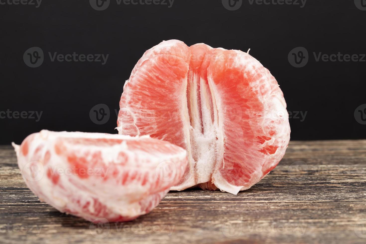divided into whole slices delicious sour red grapefruit photo