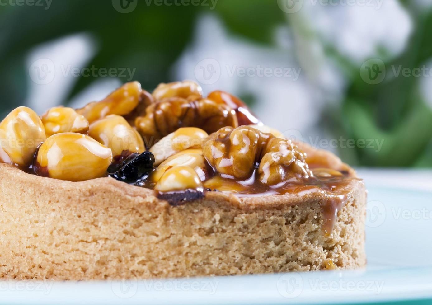 nut tartlets covered with a layer of sugar caramel photo
