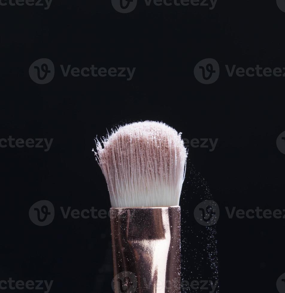 professional cosmetic brush with cosmetic product photo