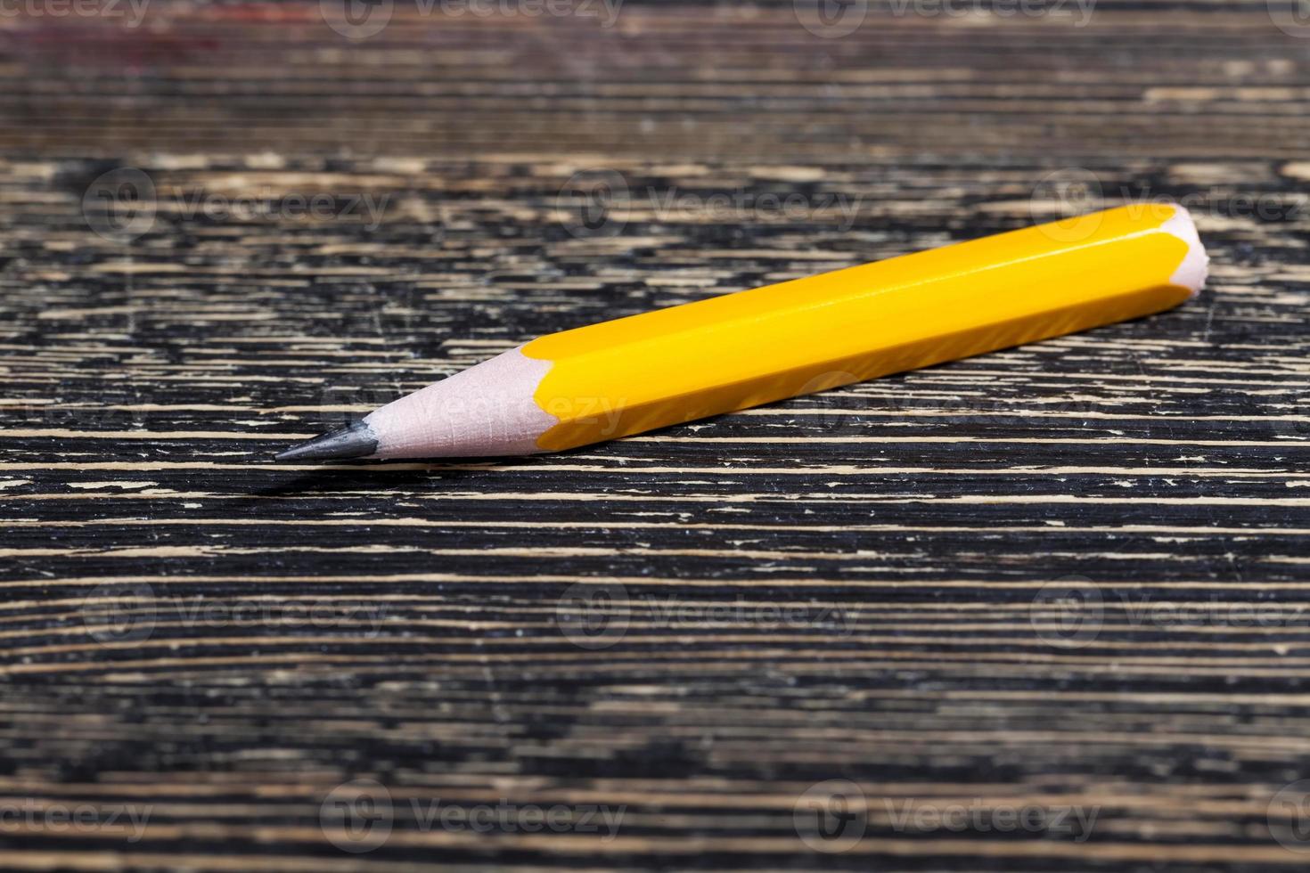 ordinary yellow wooden pencil photo