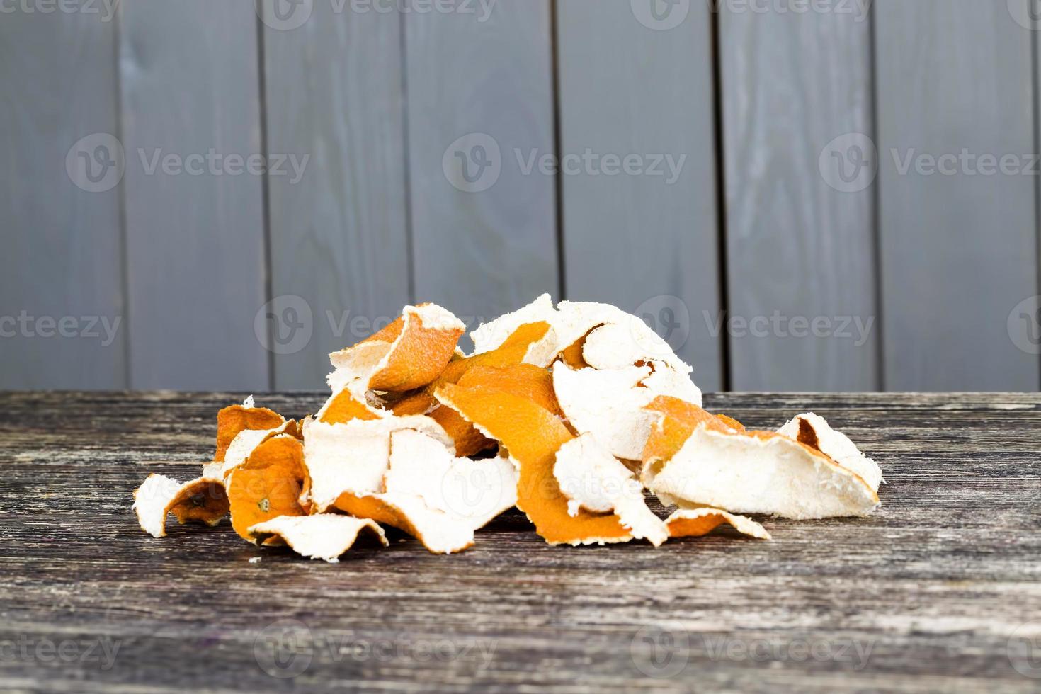 citrus peel on an old wooden table photo