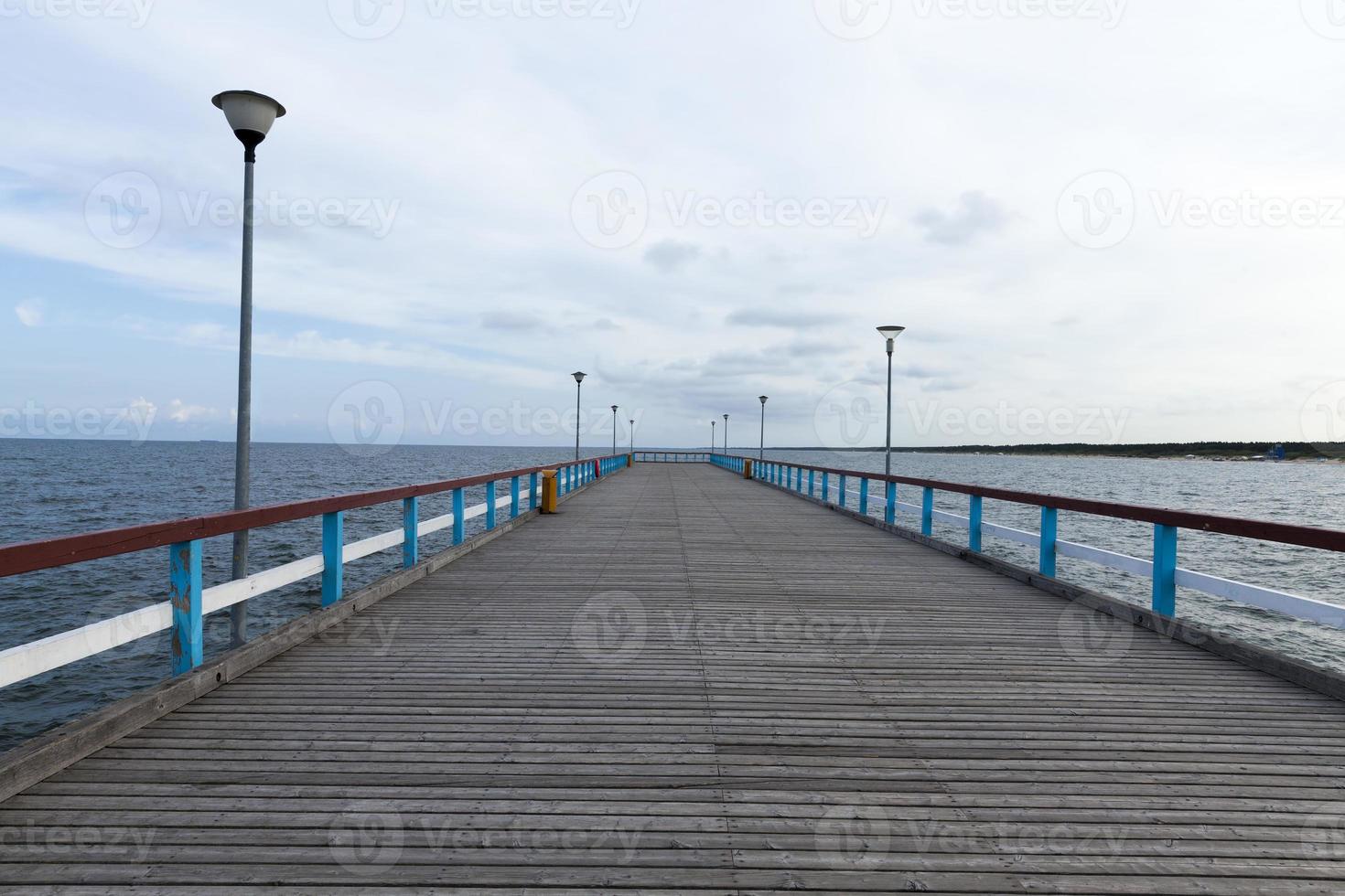 a long pier on the territory of the sea photo