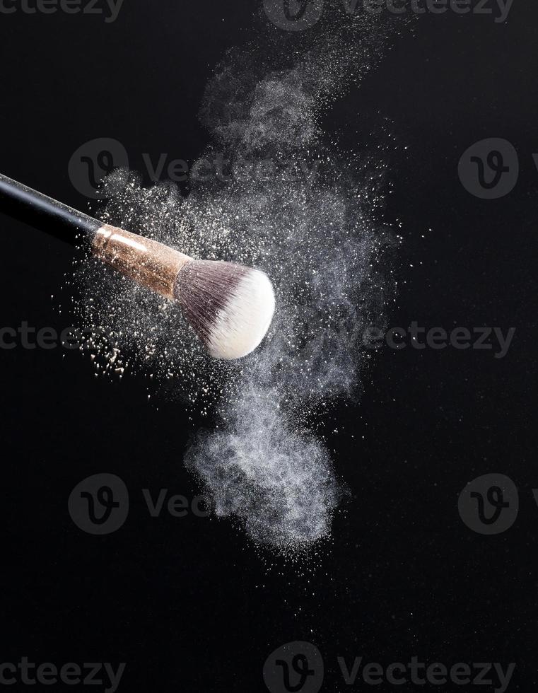 professional cosmetic brush with cosmetic product photo