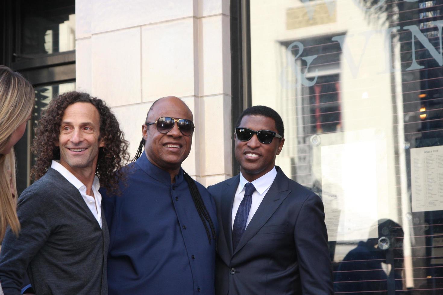 LOS ANGELES, OCT 10 -  Kenny G, Stevie Wonder, Kenny Babyface Edmonds at the Kenny Babyface Edmonds Hollywood Walk of Fame Star Ceremony at Hollywood Boulevard on October 10, 2013 in Los Angeles, CA photo