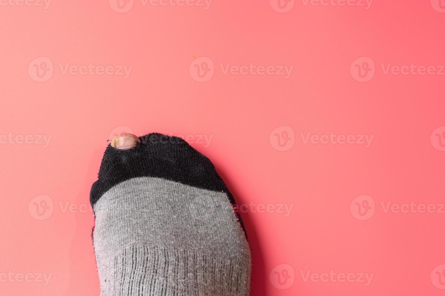Broken sock with a hole. photo