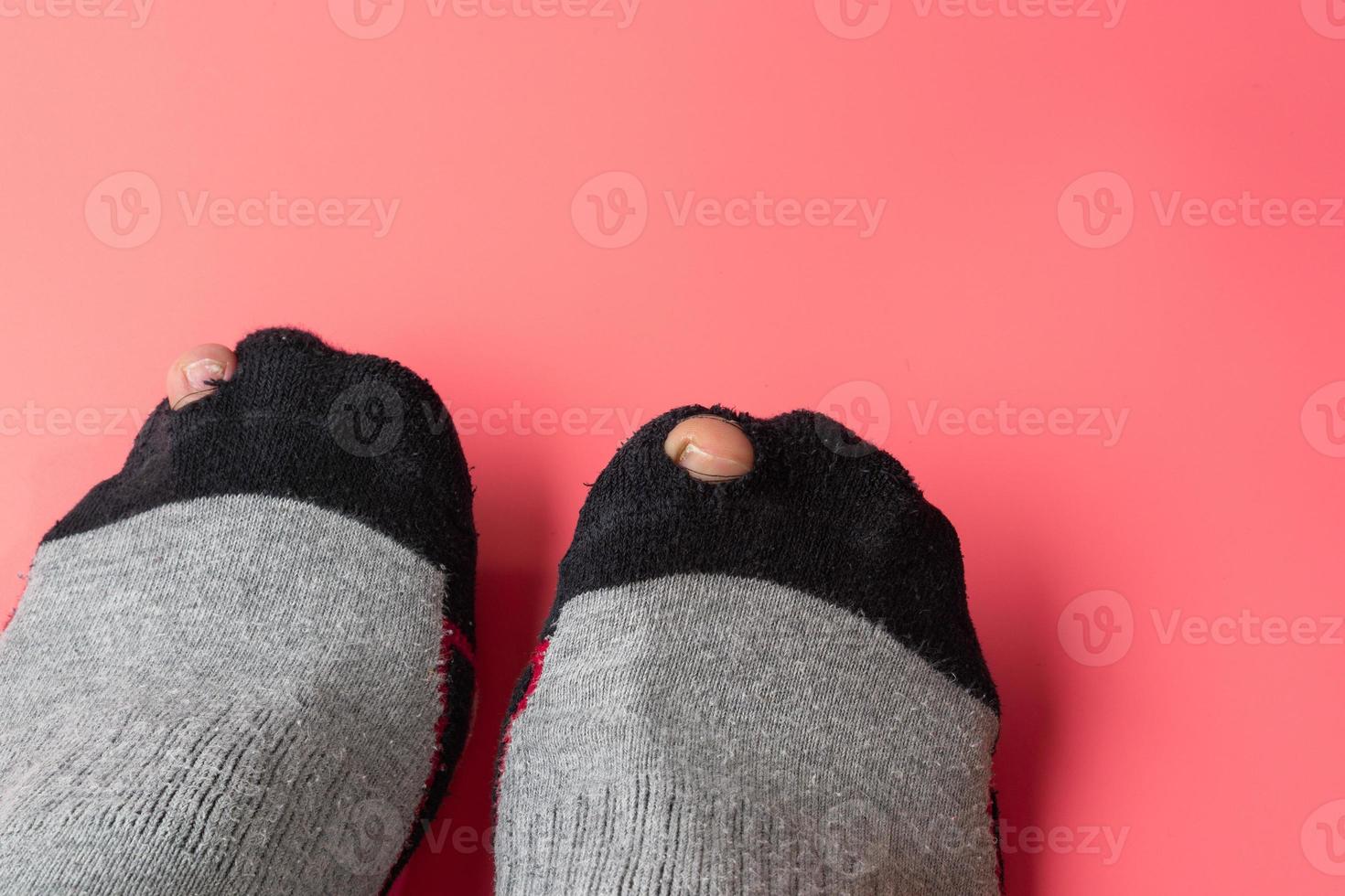 Broken sock with a hole. photo