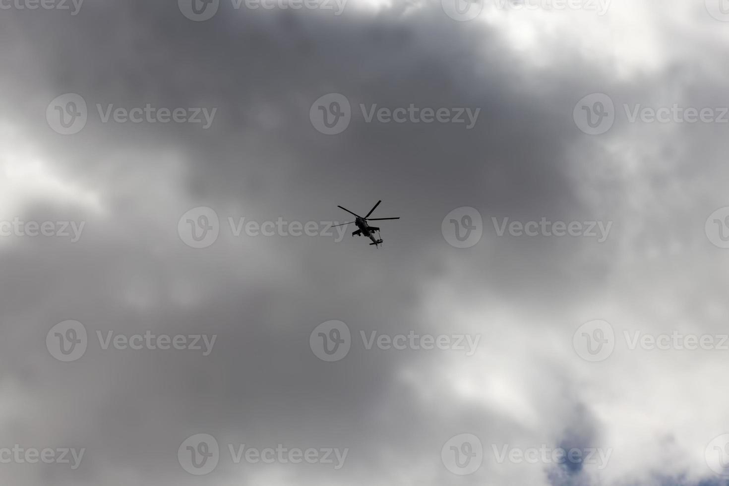 a helicopter flying in sky photo