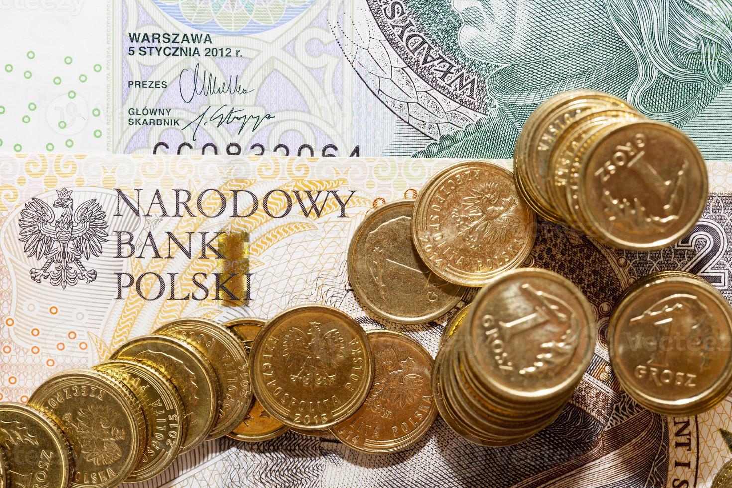 Polish coins lying on paper signs Poland photo