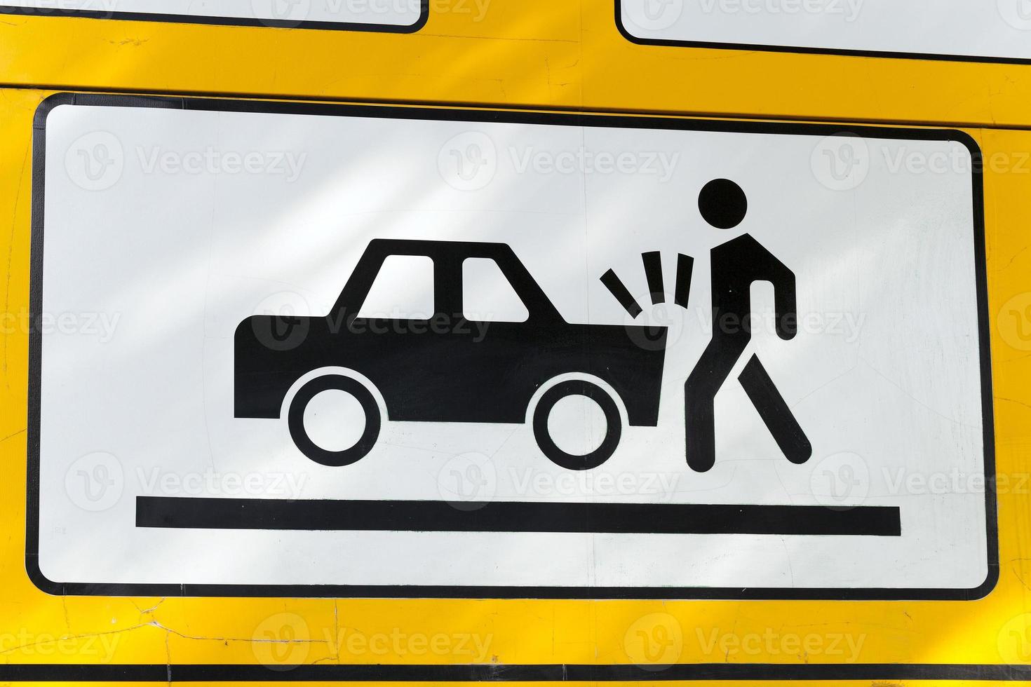 road sign on collision with a car photo