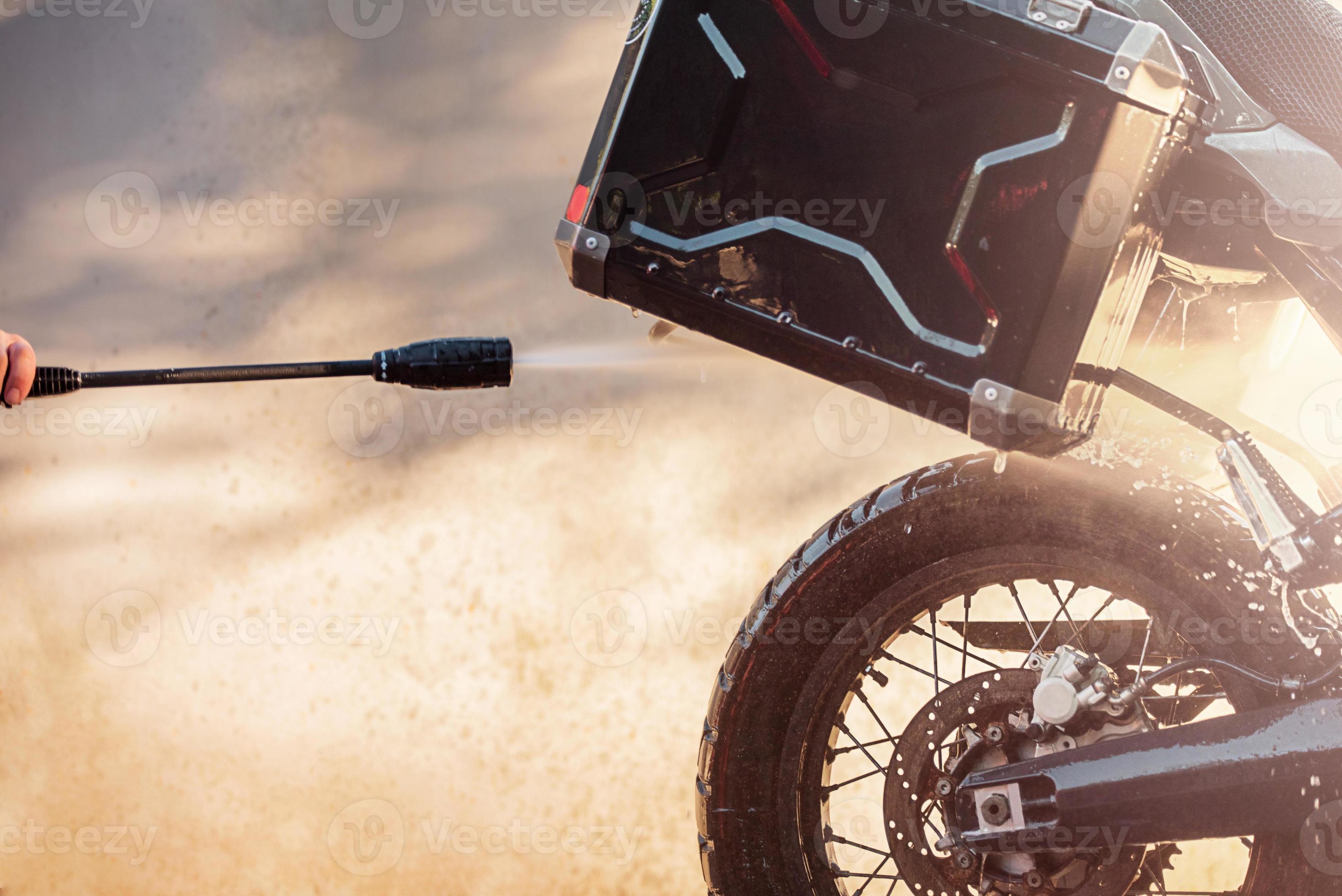 A clean wet motorcycle of the enduro class. Wash the trunk. Car wash