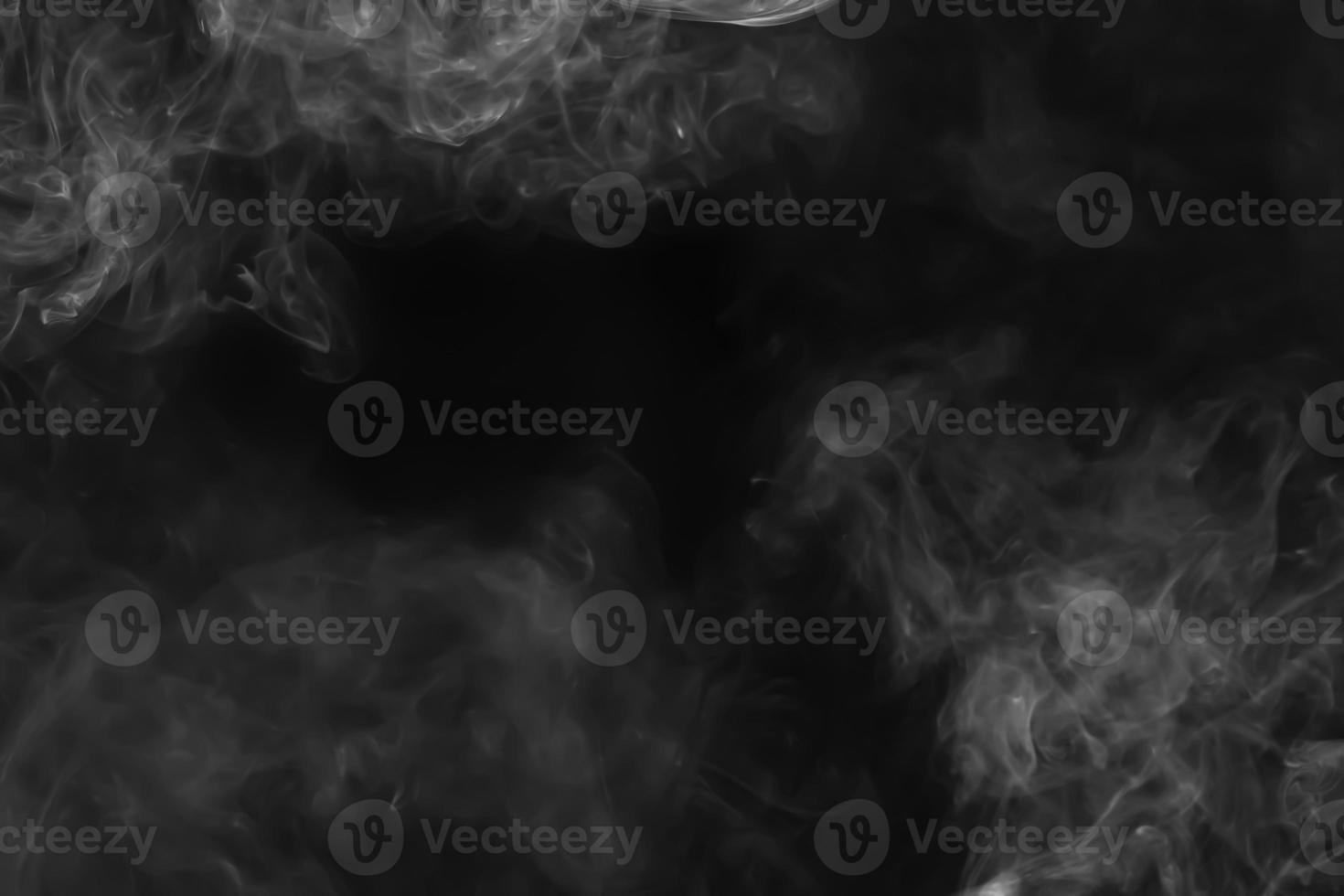 Abstract white smoke animated on a black background photo