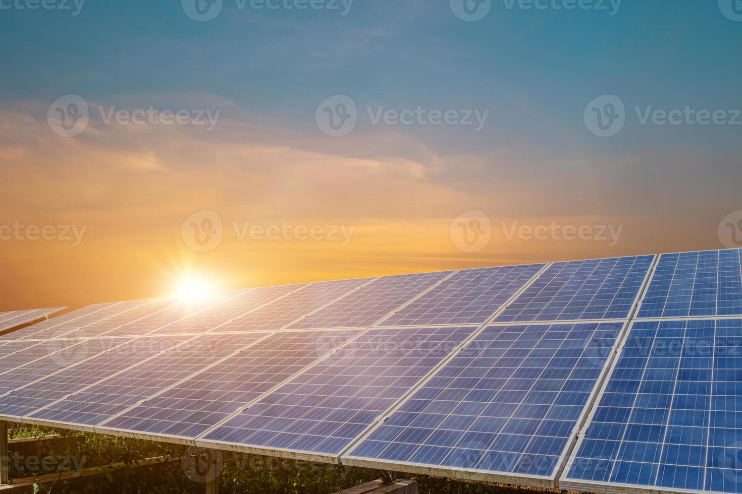 Solar panel at beautiful sunset sky background. Photovoltaic, alternative electricity source photo