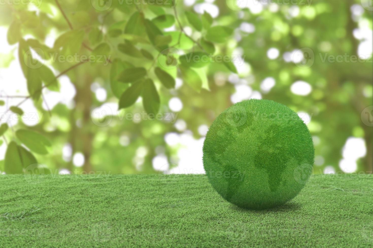 green grass globe earth on meadow over blur nature background. World environment day concept photo