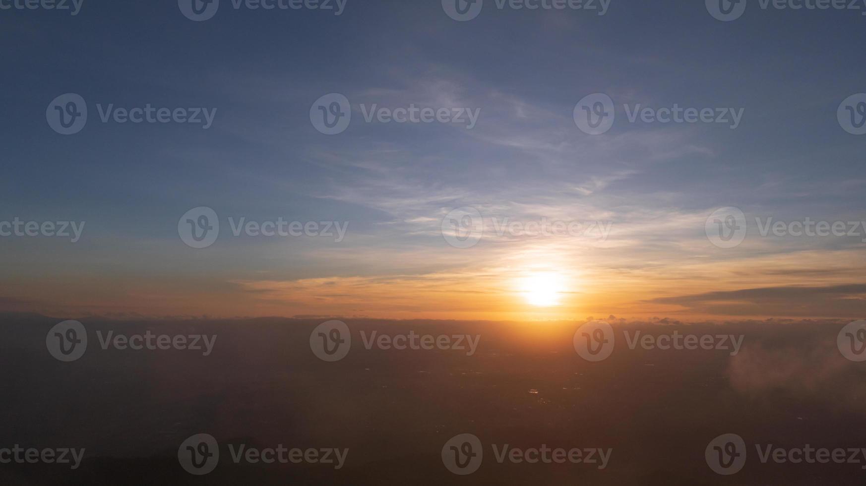 Bright orange sky and light of the sunrise at morning. photo