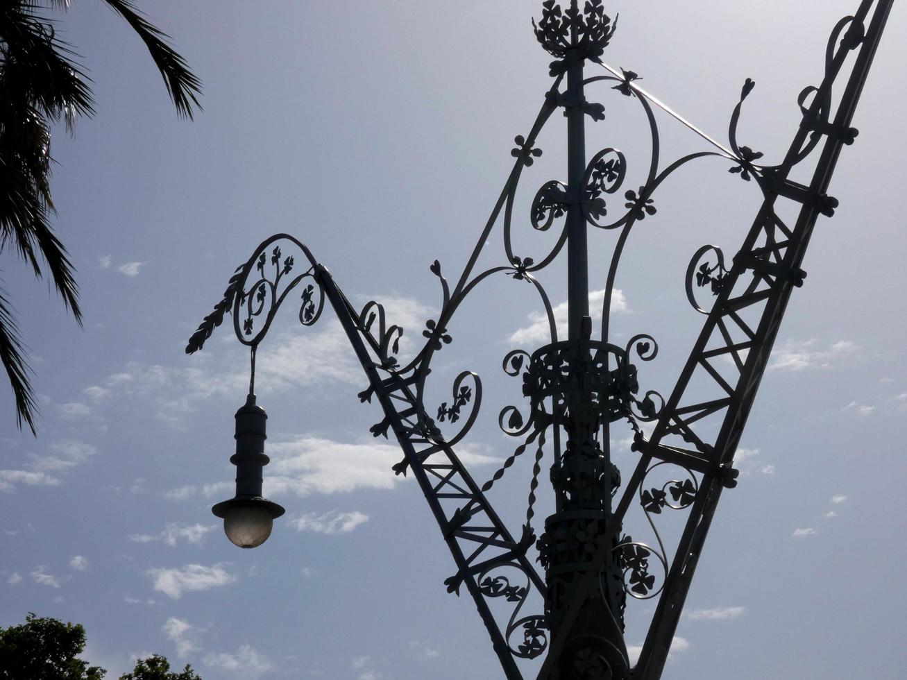 backlit details of a modernist chandelier in the city of Barcelona photo
