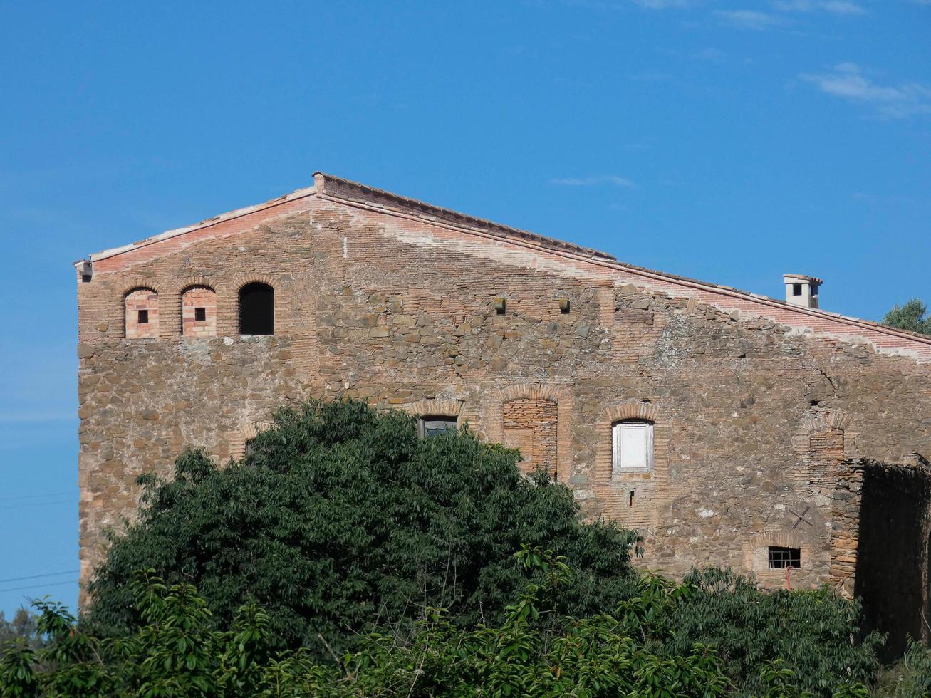 Typical Catalan mountain house in the vicinity of Barcelona, Spain photo