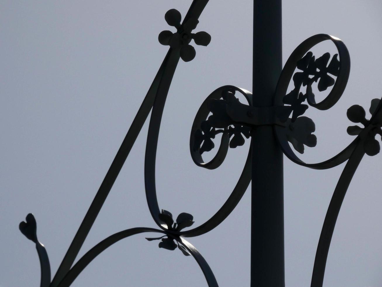 backlit details of a modernist chandelier in the city of Barcelona photo