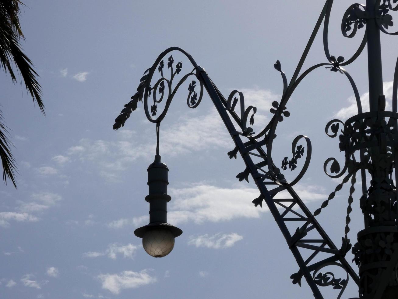 backlit details of a modernist chandelier in the city of Barcelona photo