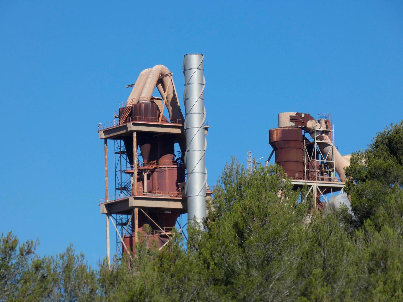 Cement factory with no activity in the vicinity of the city of Barcelona photo