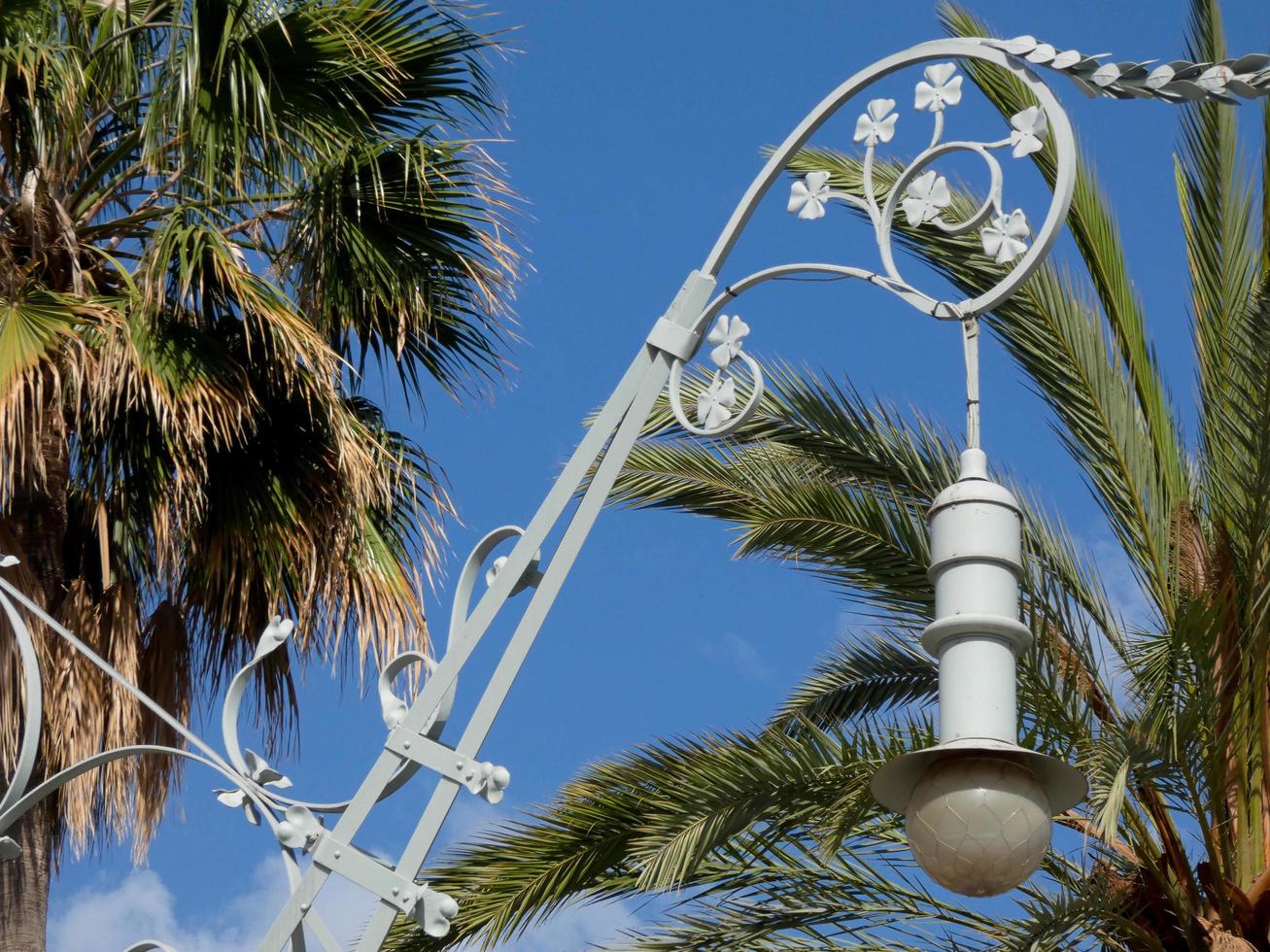backlit details of a modernist chandelier in the city of Barcelona photo