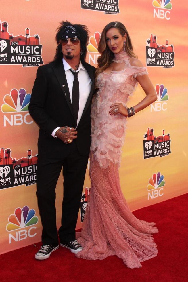 LOS ANGELES, MAY 1 - Nikki Sixx, Courtney Bingham at the 1st iHeartRadio Music Awards at Shrine Auditorium on May 1, 2014 in Los Angeles, CA photo