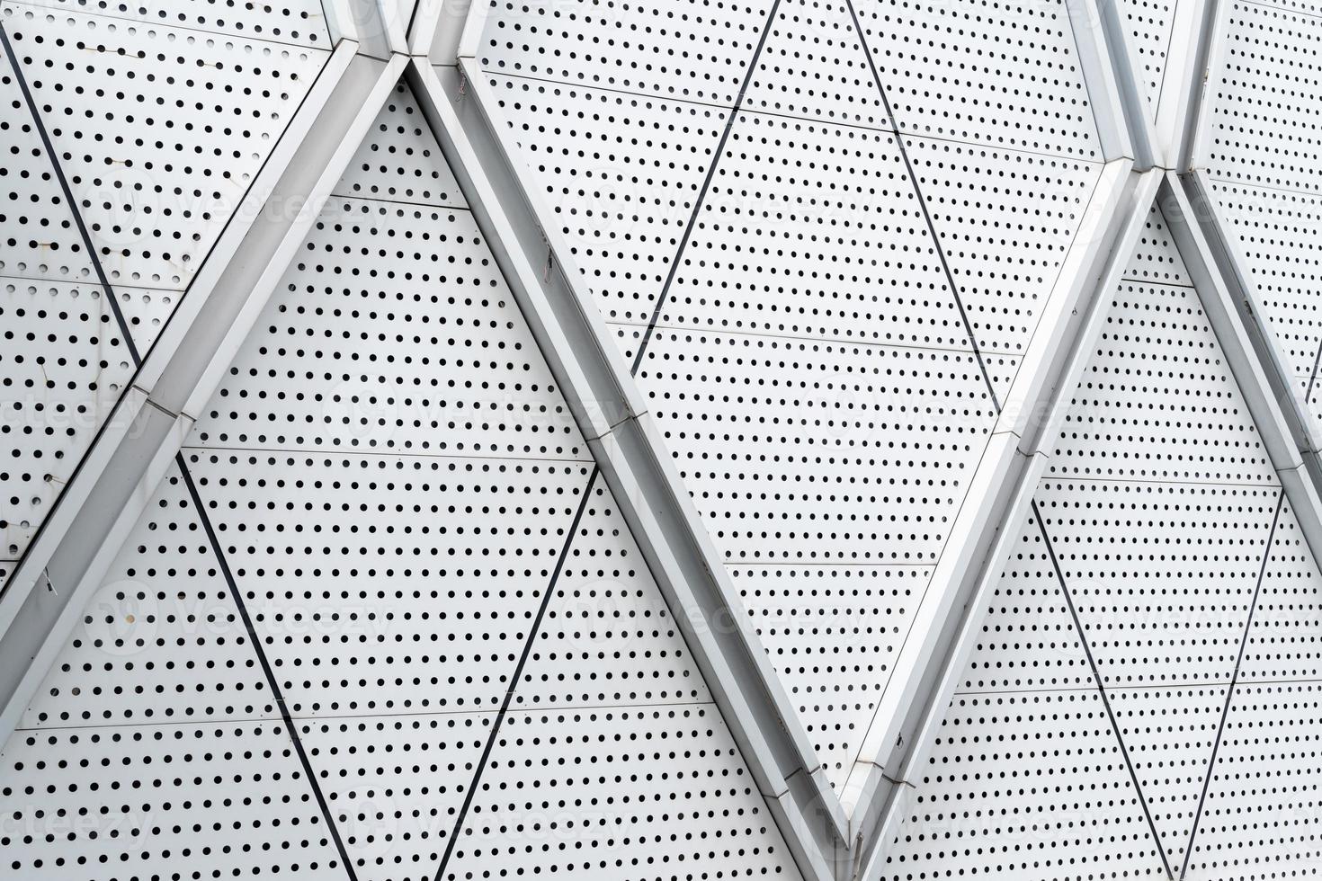 aluminium composite panels or cladding with perforated sheets on modern building facade, Abstract architecture background concept. photo