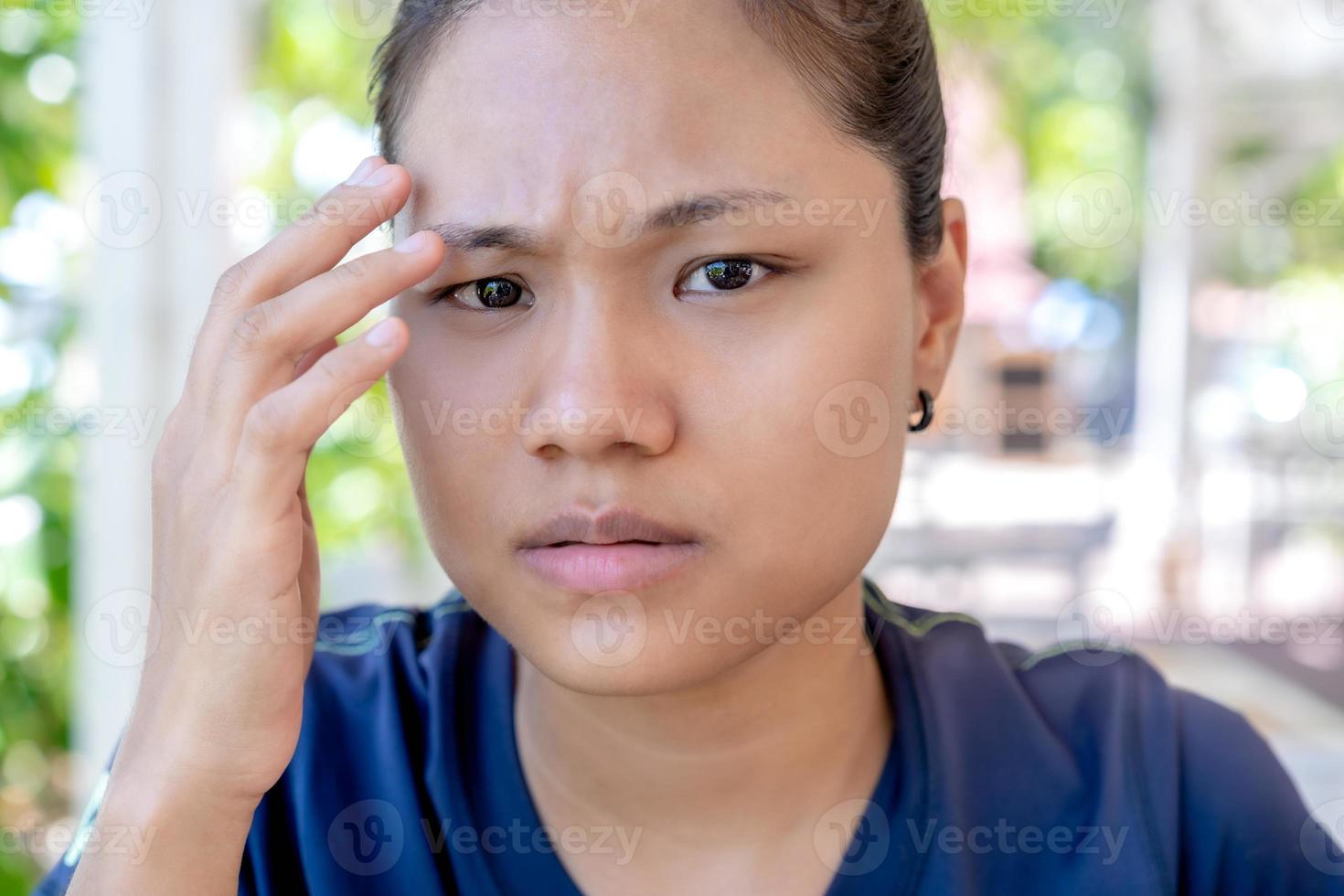 Young woman with upset expression looking at camera. Confused girl expressing distrust and suspicion, doubt and confusion. Woman with disgruntled face, worried and troubled uneasy, stare camera angry photo