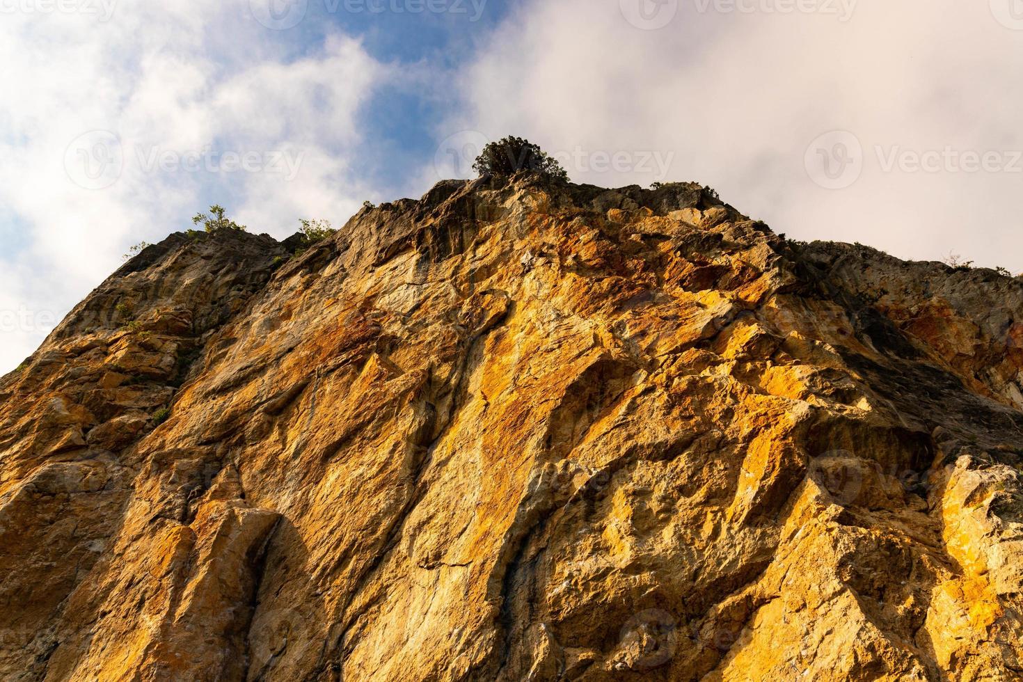 Red Red stone is a rock of pinkish-yellow marbled limestone. photo