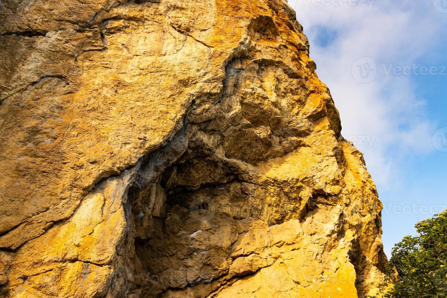 Red Red stone is a rock of pinkish-yellow marbled limestone. photo