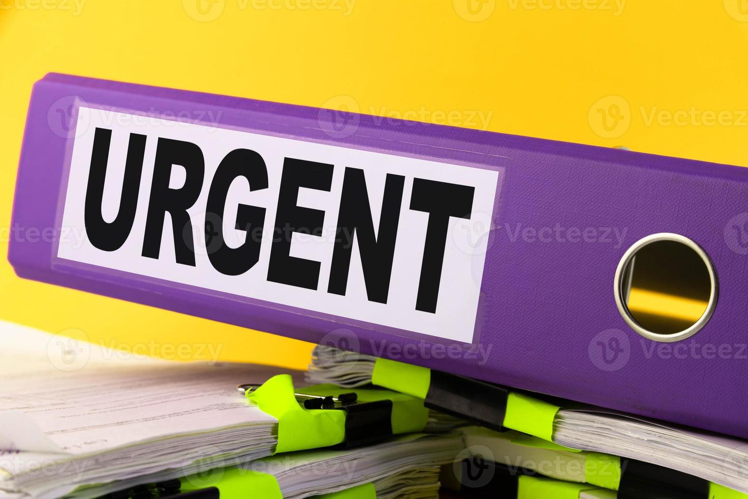 Urgent, Situation Needed, Imperative Important concept. purple folder with the words URGENT. photo
