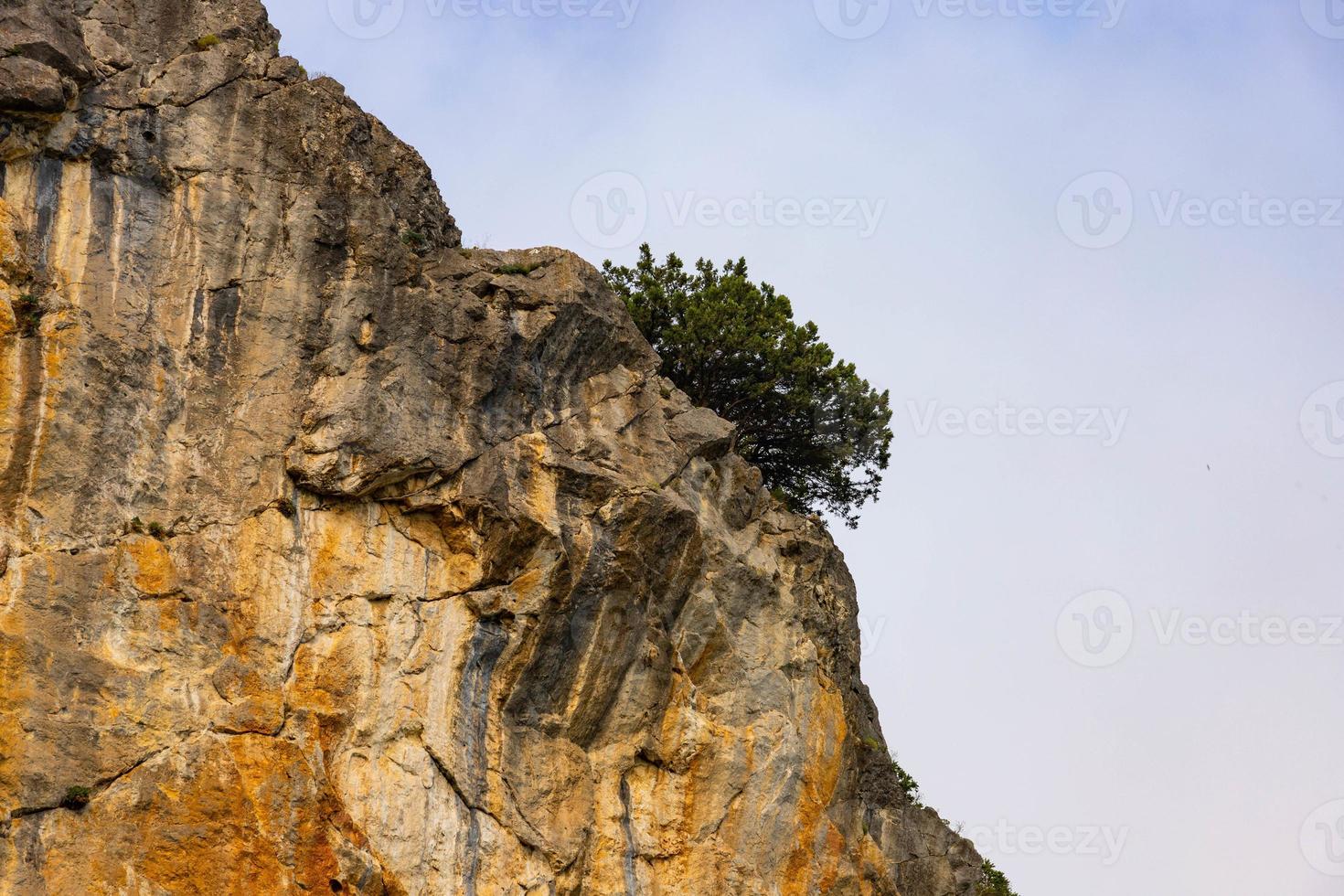 Red Red stone is a rock of pinkish-yellow marbled limestone. photo