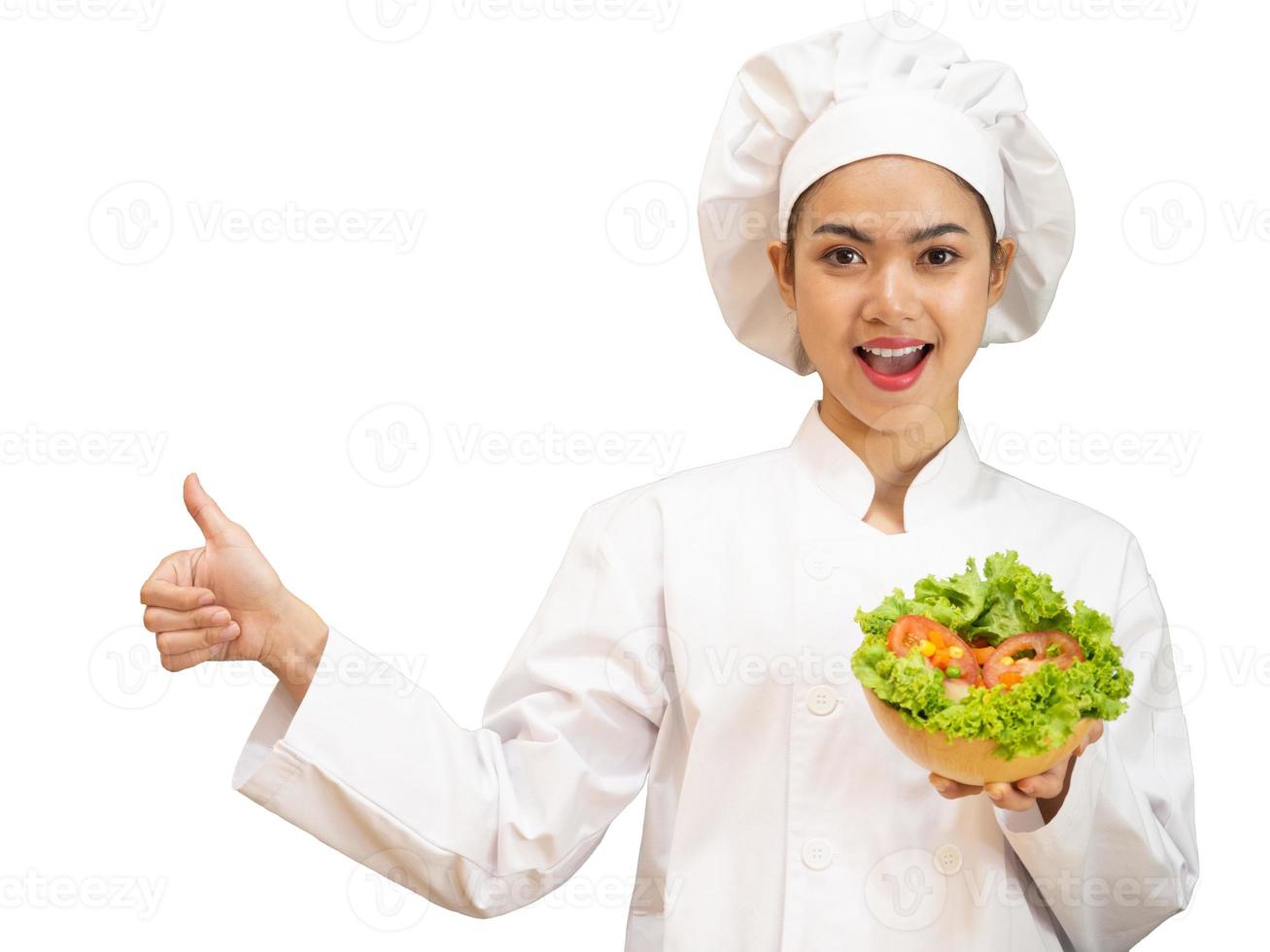 Asian woman in chef's uniform is cooking in the kitchen photo