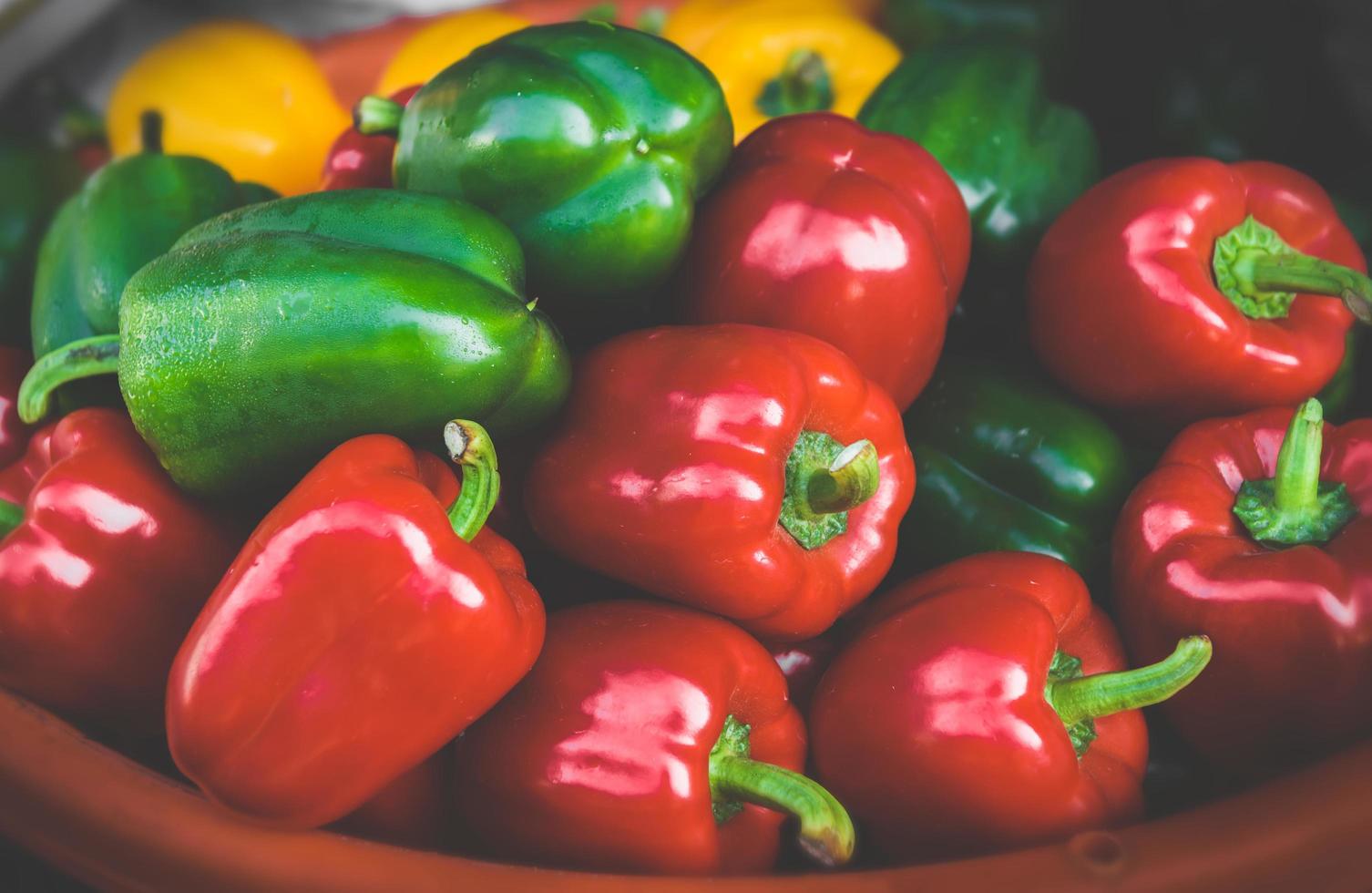 Group of red , green and yellow bell peppers. photo