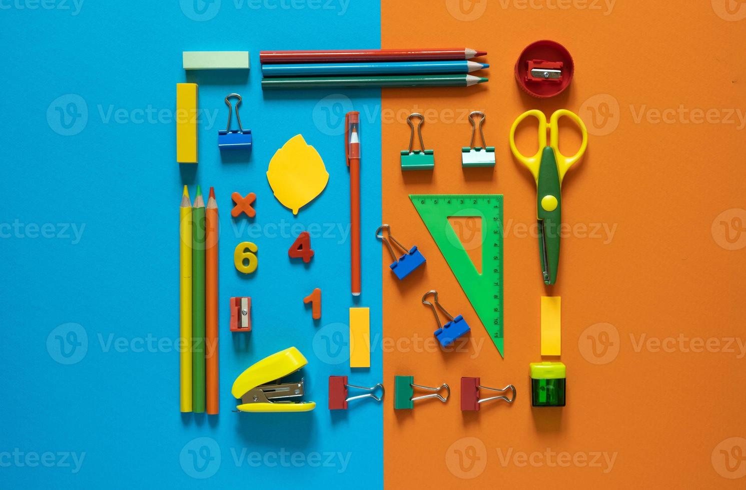 Back to school concept. School and office supplies on the office table. 2 color background.Flat lay with copy space.Autumn photo