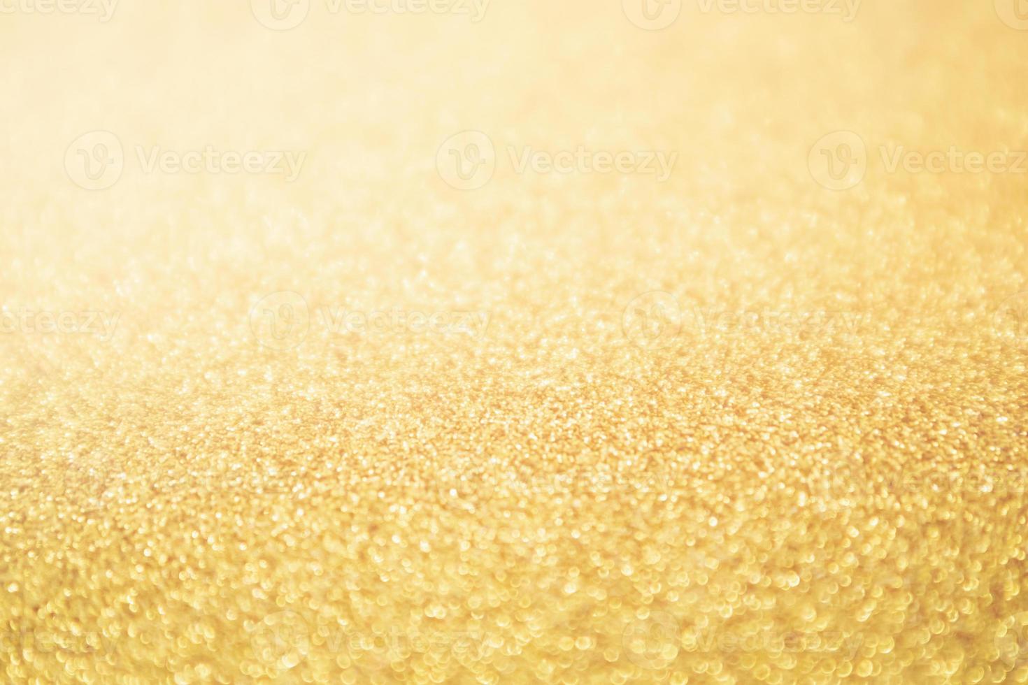 Abstract Gold glitter festive Christmas texture background blur with bokeh light photo