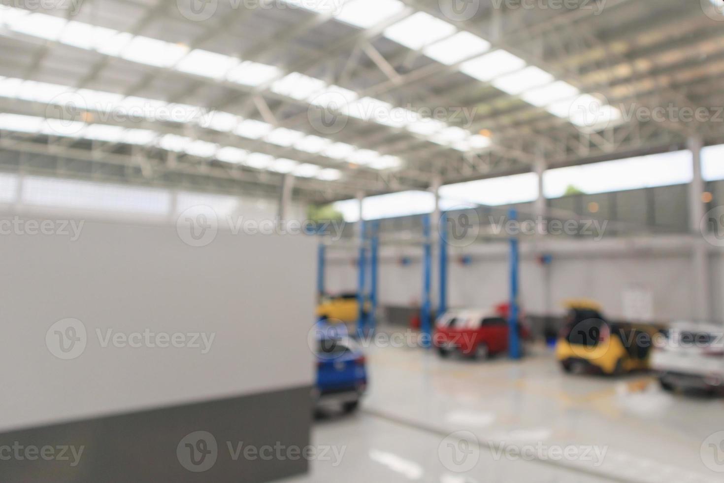car service centre with auto at repair station bokeh light defocused blur background photo