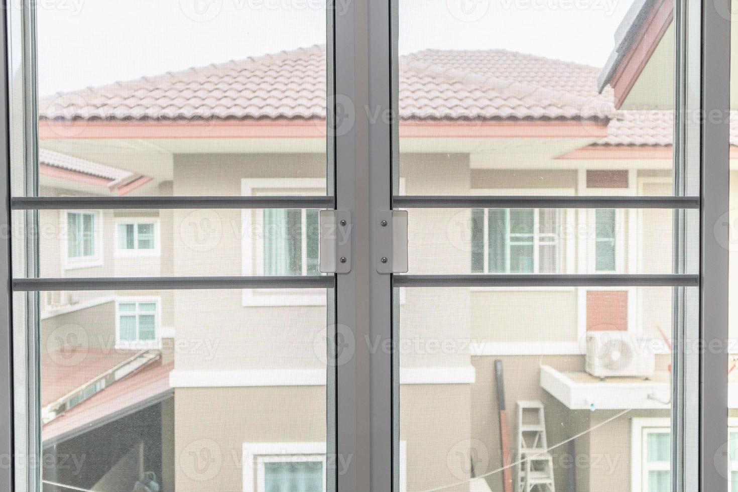 mosquito net wire screen on house window protection against insect photo